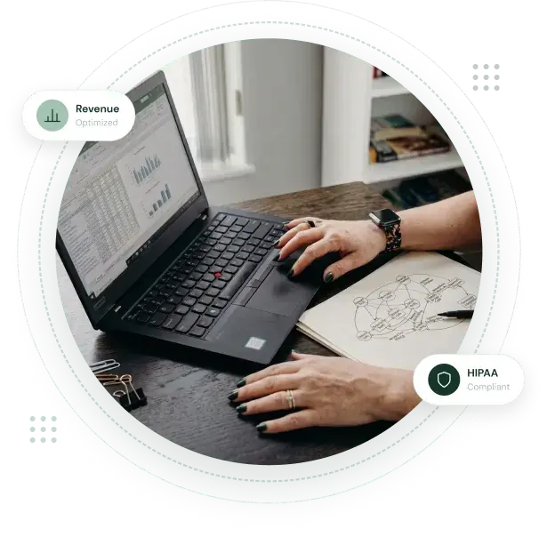 Healthcare administrator analyzing revenue cycle management metrics on laptop